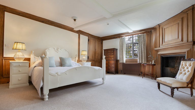 Bedroom 3 'Partridge,' with a super king-size bed, on the first floor of Thorington Hall, Suffolk